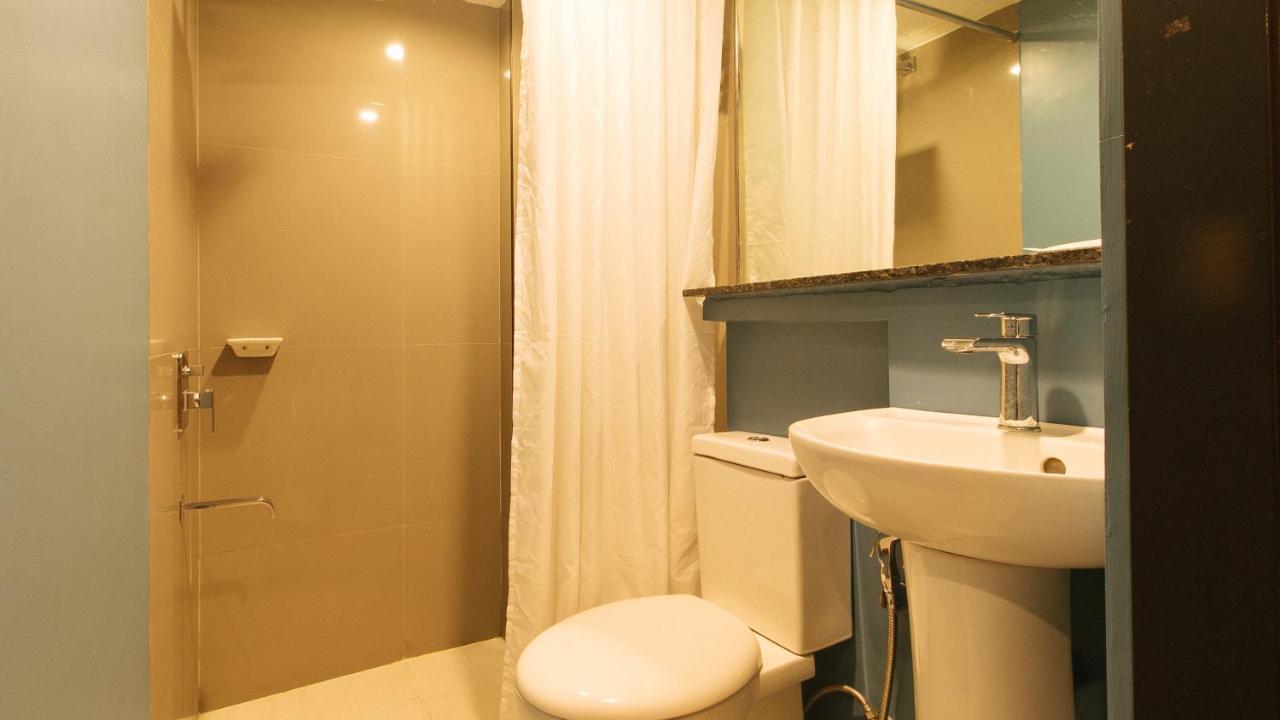 Guijo Suites Makati Макати Экстерьер фото