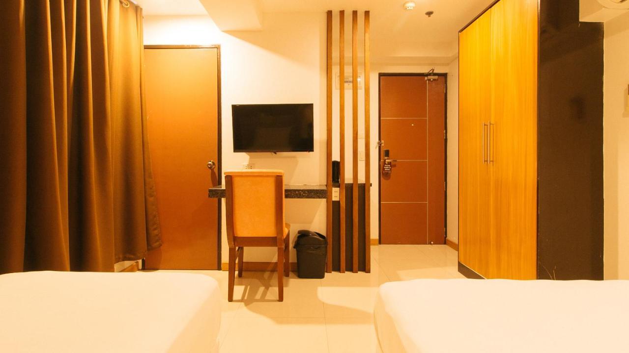 Guijo Suites Makati Макати Экстерьер фото